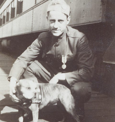 Sergeant Stubby wearing his medal beside Pvt. Robert Conroy in an archival photograph